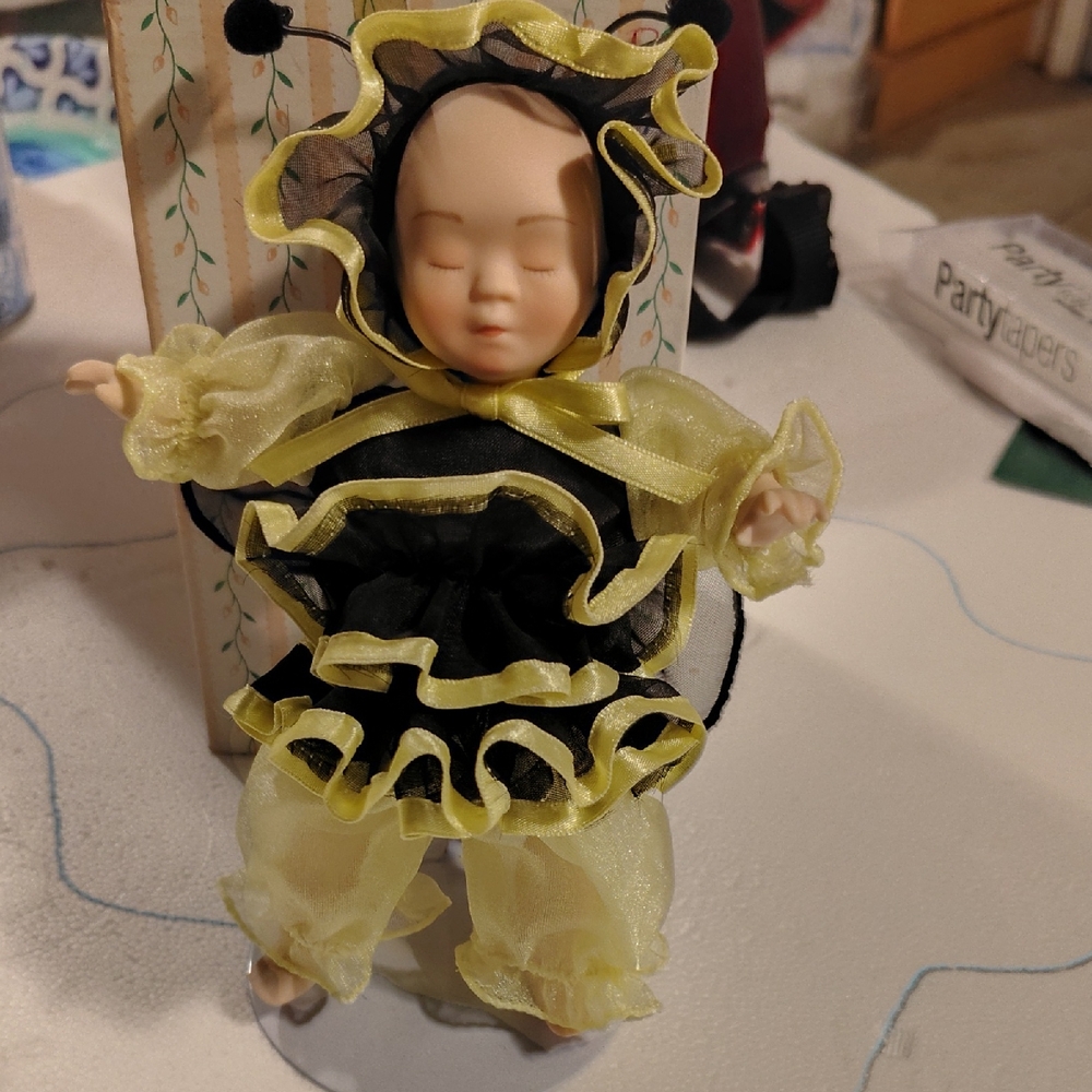 Adorable Doll with Yellow and Black Ruffles